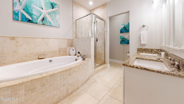 11807 Front Beach Rd Unit 2204, Panama City Beach, FL 32407 - full bathroom featuring a stall shower, a garden tub, double vanity, and tile patterned flooring