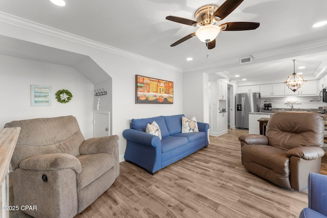 23223 Front Beach Rd Unit 335, Panama City Beach, FL 32413 - living area with ceiling fan, recessed lighting, light wood-style floors, crown molding, and baseboards
