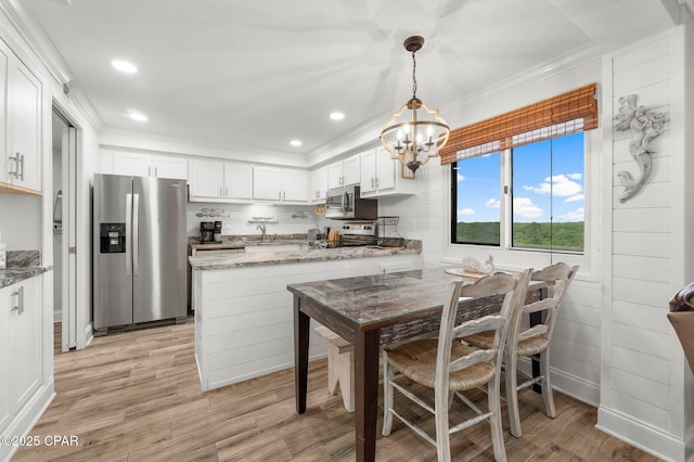 23223 Front Beach Rd Unit 335, Panama City Beach, FL 32413 - dining room with light wood-style flooring, ornamental molding, a chandelier, and recessed lighting
