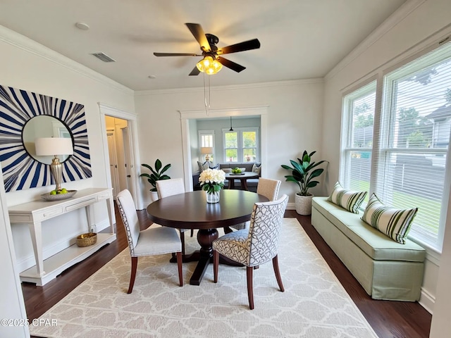 2969 Russ St, Marianna, FL 32446 - dining room with wood finished floors, a ceiling fan, baseboards, and crown molding