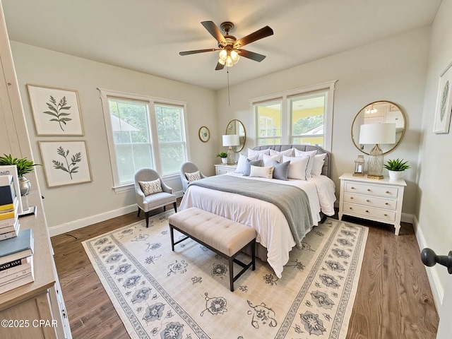 2969 Russ St, Marianna, FL 32446 - bedroom featuring multiple windows, wood finished floors, baseboards, and ceiling fan