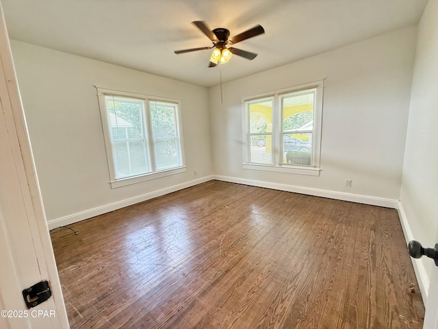 2969 Russ St, Marianna, FL 32446 - empty room with dark wood-style floors, baseboards, and ceiling fan