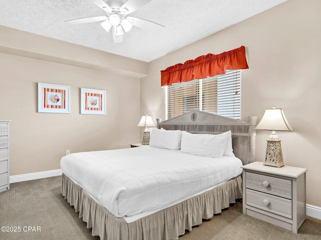 7115 Thomas Dr Unit 602, Panama City Beach, FL 32408 - bedroom featuring light carpet, a textured ceiling, and a ceiling fan