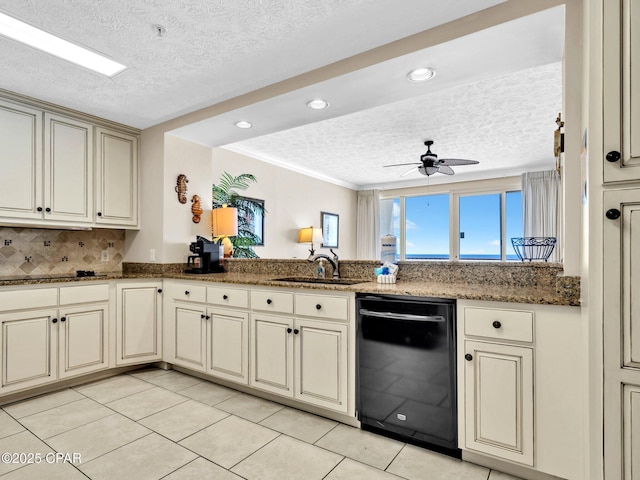 7115 Thomas Dr Unit 602, Panama City Beach, FL 32408 - kitchen featuring black dishwasher, a textured ceiling, cream cabinetry, light tile patterned floors, and recessed lighting