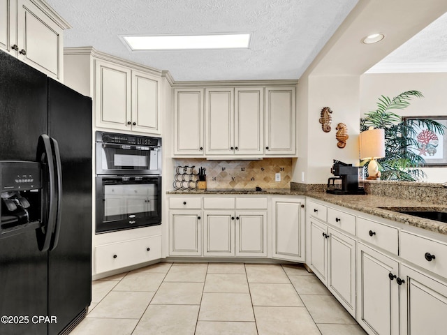 7115 Thomas Dr Unit 602, Panama City Beach, FL 32408 - kitchen with black appliances, light tile patterned floors, stone countertops, decorative backsplash, and a textured ceiling