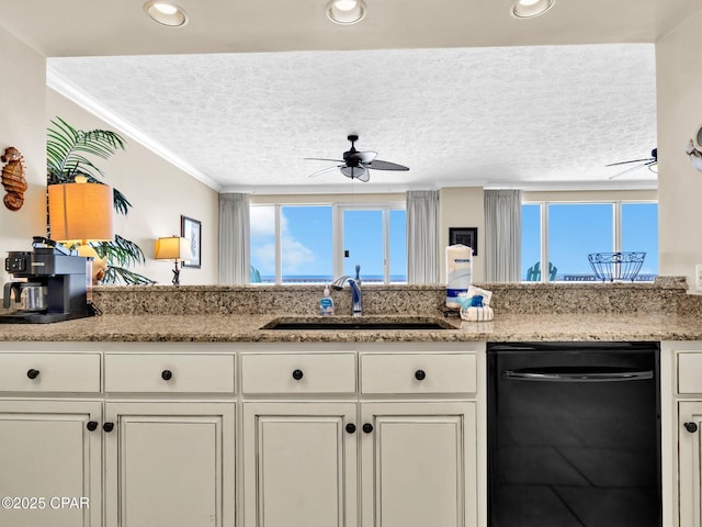 7115 Thomas Dr Unit 602, Panama City Beach, FL 32408 - kitchen featuring dishwasher, a ceiling fan, a textured ceiling, crown molding, and light stone countertops