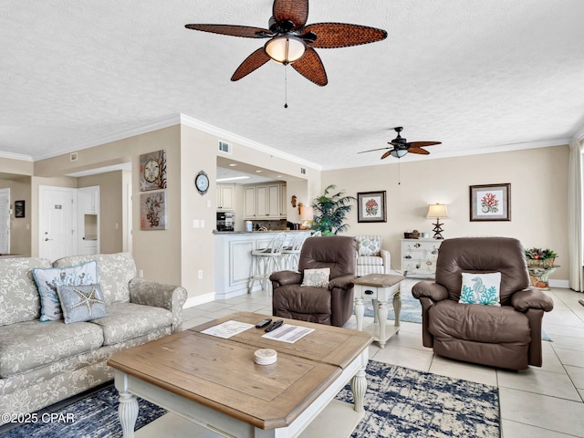 7115 Thomas Dr Unit 602, Panama City Beach, FL 32408 - living area featuring ceiling fan, a textured ceiling, light tile patterned floors, and crown molding
