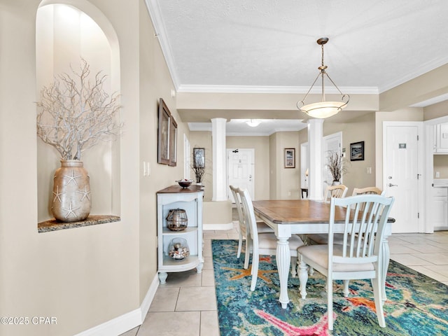7115 Thomas Dr Unit 602, Panama City Beach, FL 32408 - dining area featuring decorative columns, crown molding, and light tile patterned floors
