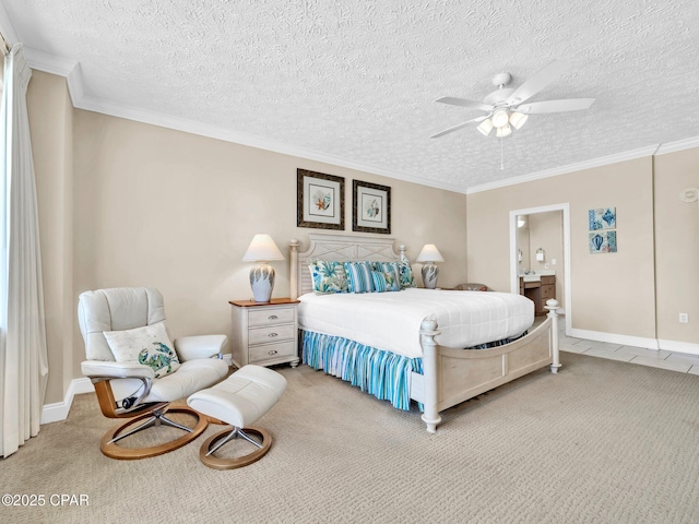 7115 Thomas Dr Unit 602, Panama City Beach, FL 32408 - carpeted bedroom featuring ornamental molding, ensuite bath, ceiling fan, and a textured ceiling