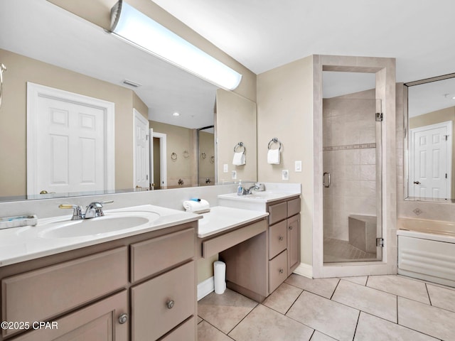 7115 Thomas Dr Unit 602, Panama City Beach, FL 32408 - bathroom with double vanity, a shower stall, tile patterned flooring, and a bath