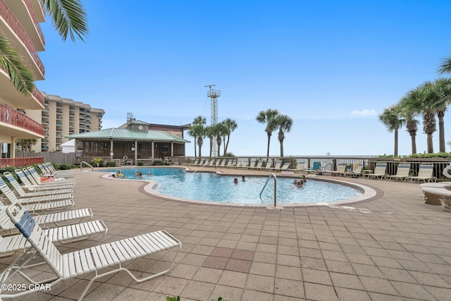 7115 Thomas Dr Unit 602, Panama City Beach, FL 32408 - community pool featuring a patio