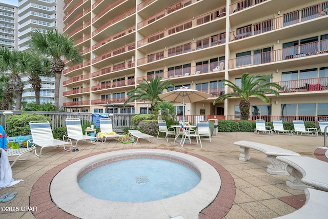 7115 Thomas Dr Unit 602, Panama City Beach, FL 32408 - view of swimming pool with a patio