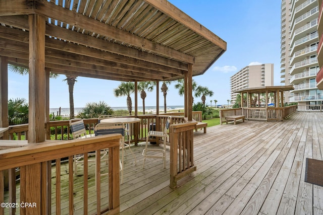 7115 Thomas Dr Unit 602, Panama City Beach, FL 32408 - wooden terrace featuring a water view
