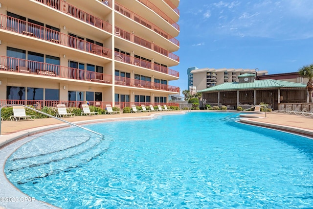 7115 Thomas Dr Unit 602, Panama City Beach, FL 32408 - community pool featuring a patio area