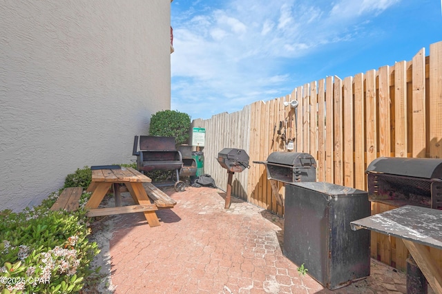7115 Thomas Dr Unit 602, Panama City Beach, FL 32408 - view of patio / terrace featuring grilling area