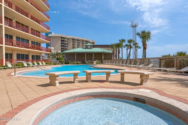 7115 Thomas Dr Unit 602, Panama City Beach, FL 32408 - community pool with a patio
