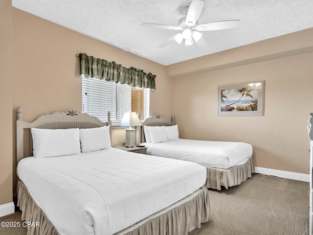 7115 Thomas Dr Unit 602, Panama City Beach, FL 32408 - bedroom featuring carpet, a textured ceiling, and ceiling fan