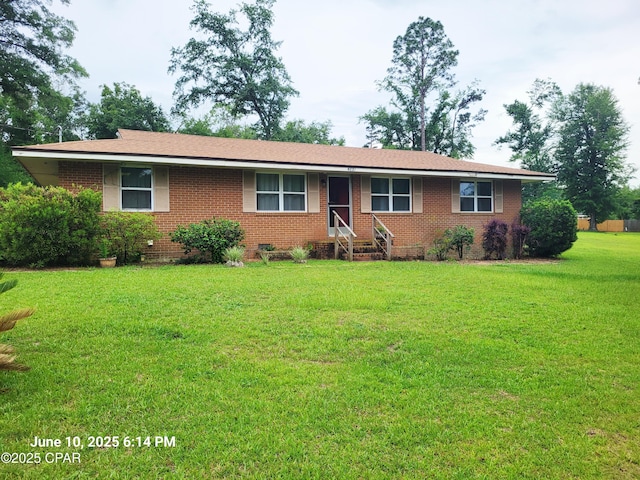 4881 Tall Pine Dr, Marianna, FL 32446 - ranch-style house featuring brick siding, a front lawn, and crawl space