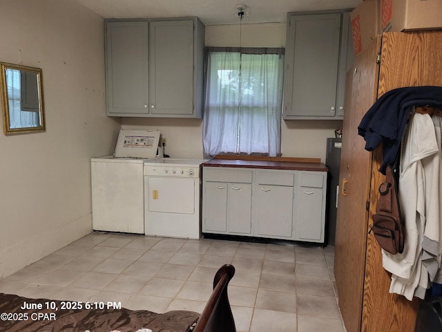 4881 Tall Pine Dr, Marianna, FL 32446 - laundry area featuring independent washer and dryer and light tile patterned floors
