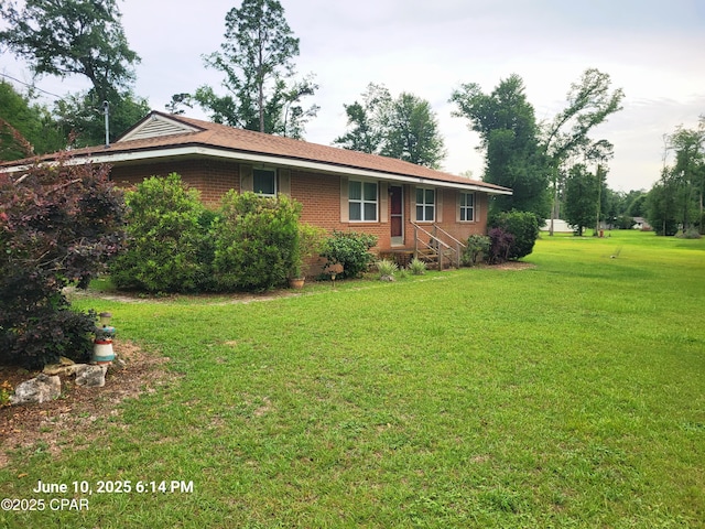 4881 Tall Pine Dr, Marianna, FL 32446 - view of front of property with brick siding and a front yard