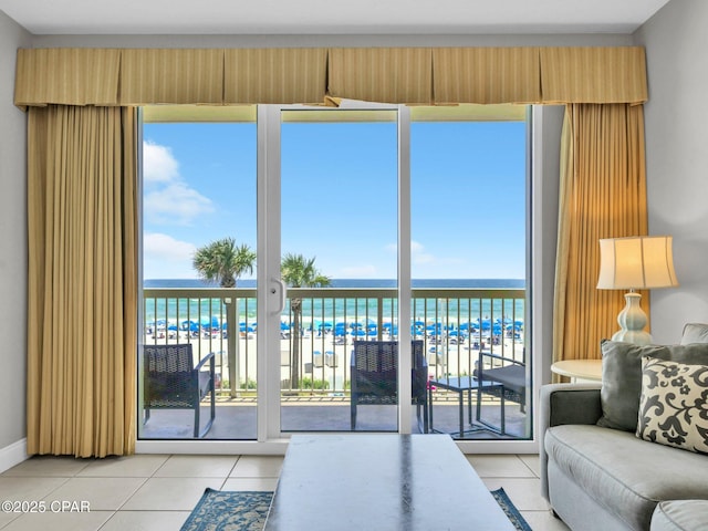 15817 Front Beach Rd Unit 1-204, Panama City Beach, FL 32413 - living room featuring light tile patterned floors and view of water and beach