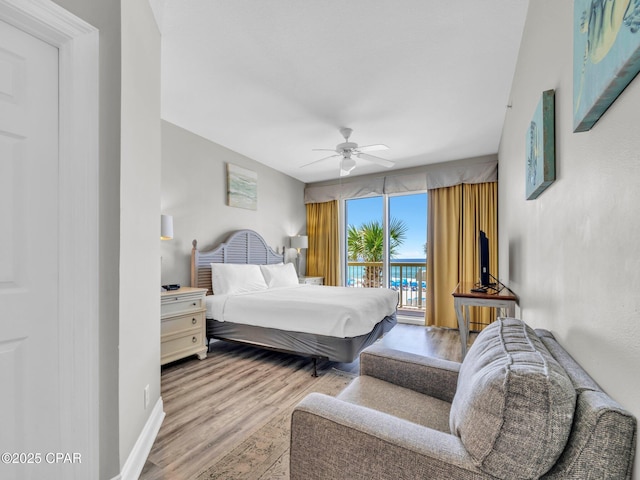 15817 Front Beach Rd Unit 1-204, Panama City Beach, FL 32413 - bedroom featuring access to exterior, wood finished floors, and a ceiling fan