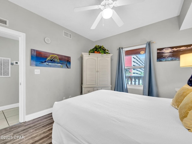 15817 Front Beach Rd Unit 1-204, Panama City Beach, FL 32413 - bedroom with wood finished floors and ceiling fan