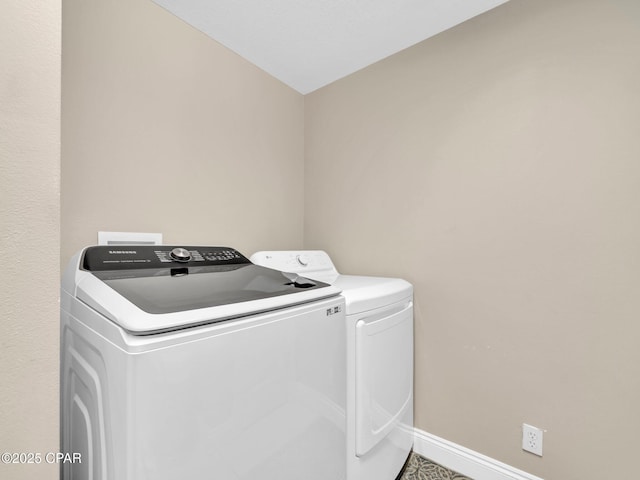 15817 Front Beach Rd Unit 1-204, Panama City Beach, FL 32413 - laundry area with washing machine and dryer and baseboards