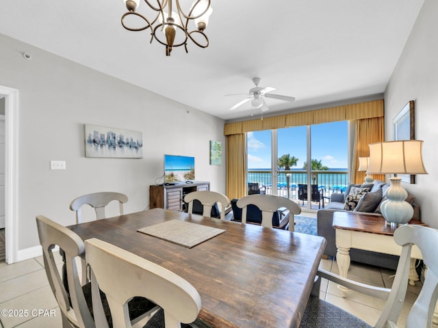 15817 Front Beach Rd Unit 1-204, Panama City Beach, FL 32413 - dining space with light tile patterned floors, ceiling fan, and a chandelier
