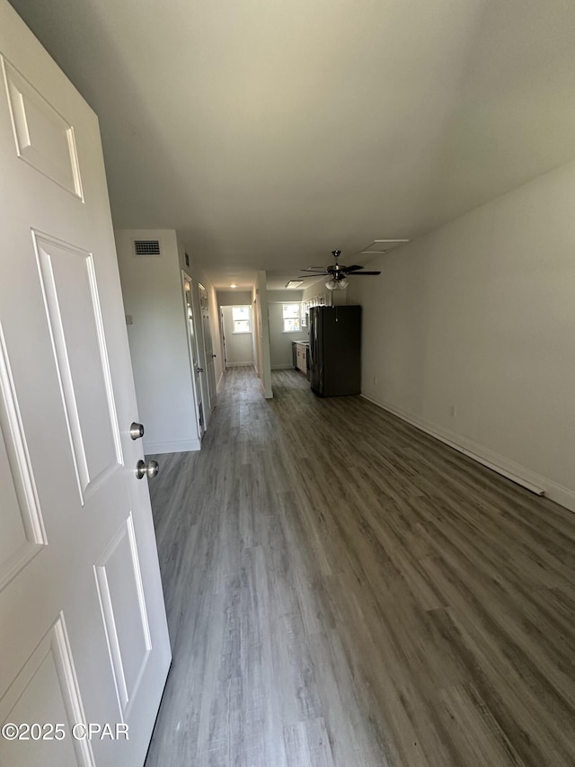 6336 Omoko St, Panama City, FL 32404 - unfurnished living room featuring wood finished floors and a ceiling fan