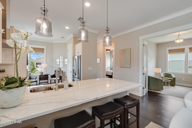 118 Ravine Rd, Inlet Beach, FL 32461 - kitchen featuring stainless steel fridge, a kitchen breakfast bar, a peninsula, dark wood-style floors, and white cabinetry