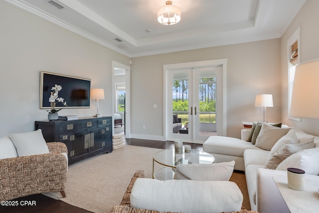 118 Ravine Rd, Inlet Beach, FL 32461 - living room featuring french doors, wood finished floors, a raised ceiling, and crown molding