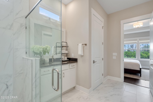 118 Ravine Rd, Inlet Beach, FL 32461 - bathroom with a marble finish shower, vanity, marble finish floors, and connected bathroom