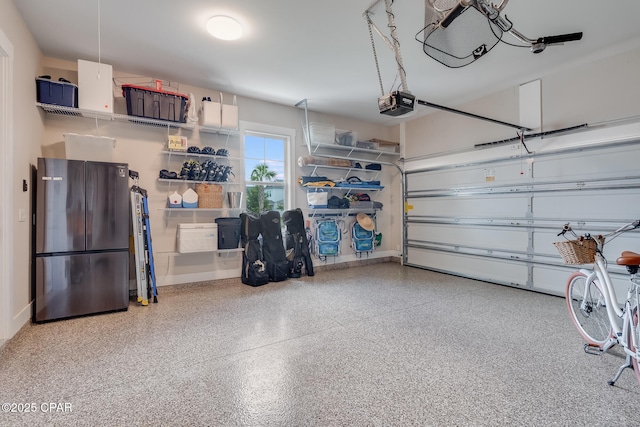 118 Ravine Rd, Inlet Beach, FL 32461 - garage featuring freestanding refrigerator and a garage door opener