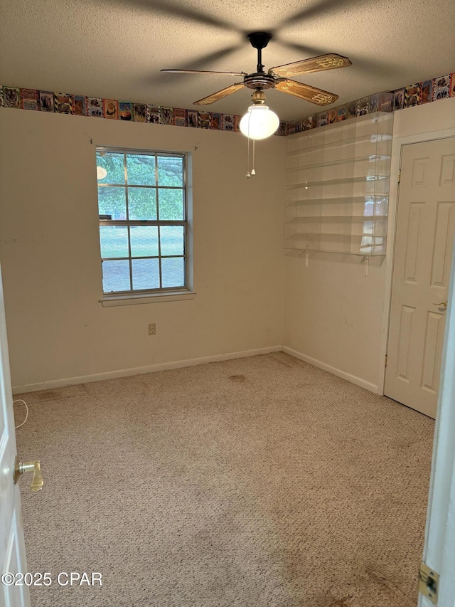 5360 Constitution Rd, Crestview, FL 32539 - empty room with a ceiling fan, a textured ceiling, and carpet flooring