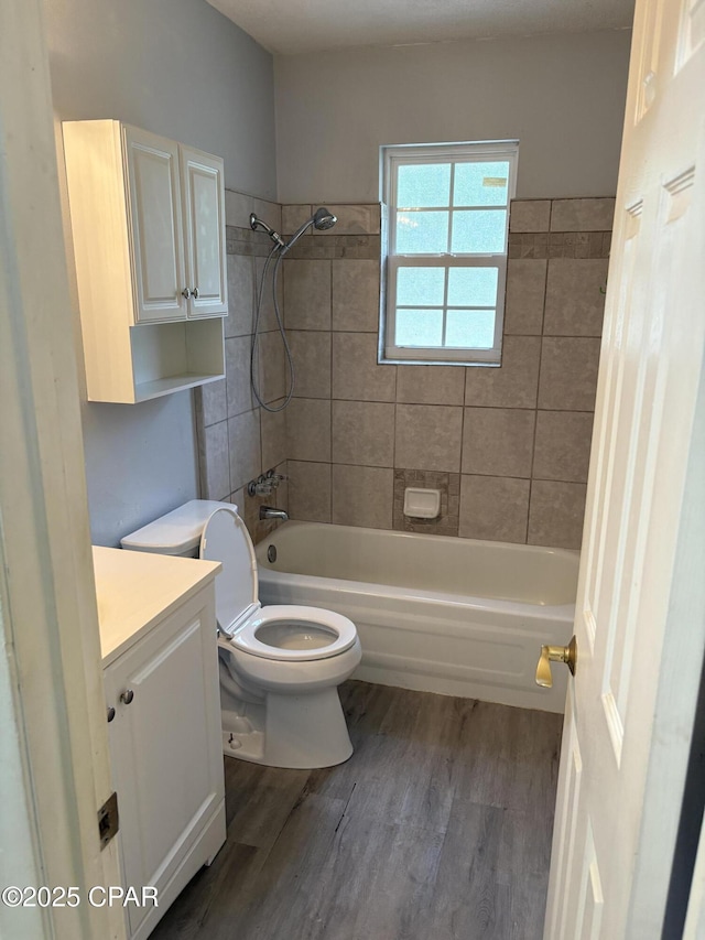 5360 Constitution Rd, Crestview, FL 32539 - full bath with vanity, wood finished floors, and washtub / shower combination