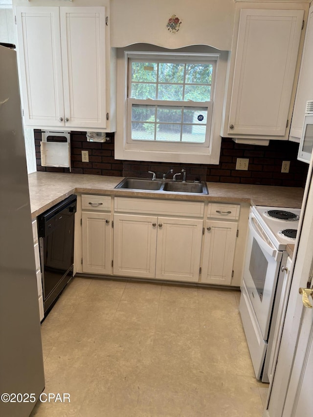 5360 Constitution Rd, Crestview, FL 32539 - kitchen featuring black dishwasher, electric range, decorative backsplash, and white cabinets