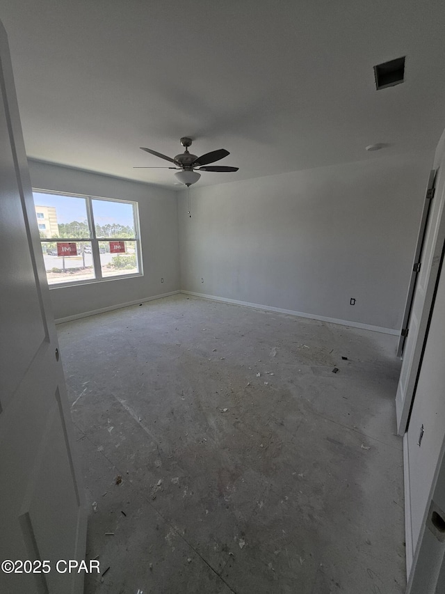 7682 Solana Ln Unit 55, Panama City Beach, FL 32407 - spare room featuring a ceiling fan and baseboards