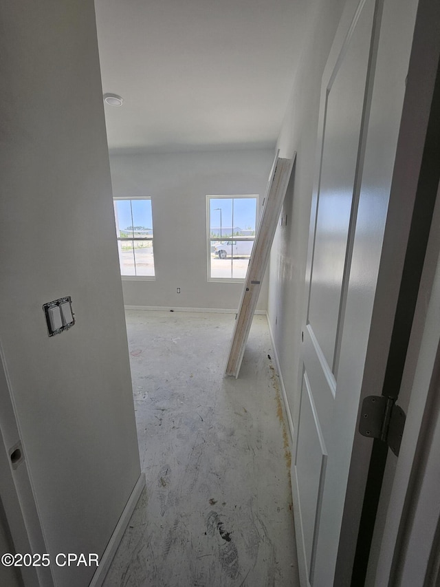 7682 Solana Ln Unit 55, Panama City Beach, FL 32407 - corridor with unfinished concrete flooring