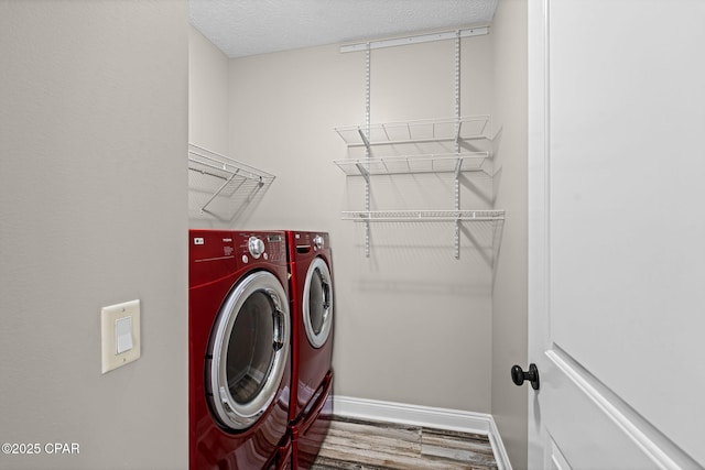 2932 Palmetto Ridge Way, Lynn Haven, FL 32444 - laundry room with washer and clothes dryer, wood finished floors, and a textured ceiling