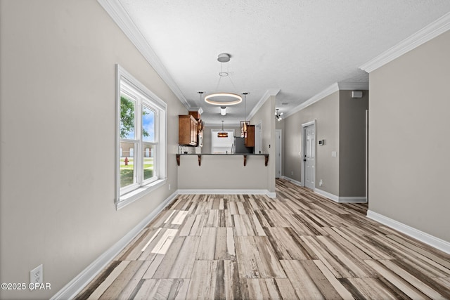 2932 Palmetto Ridge Way, Lynn Haven, FL 32444 - unfurnished living room with ornamental molding, a textured ceiling, and light wood-style floors