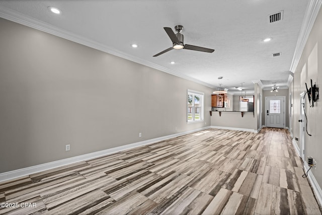 2932 Palmetto Ridge Way, Lynn Haven, FL 32444 - unfurnished living room featuring ceiling fan, ornamental molding, recessed lighting, light wood-style flooring, and a textured ceiling