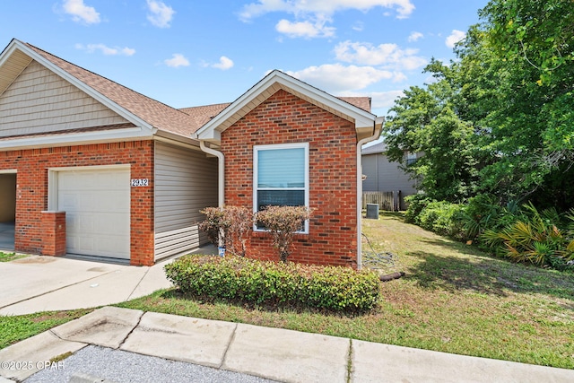 2932 Palmetto Ridge Way, Lynn Haven, FL 32444 - view of front of house featuring a garage, brick siding, and a front yard