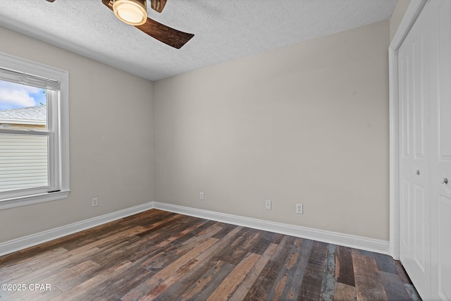 2932 Palmetto Ridge Way, Lynn Haven, FL 32444 - unfurnished bedroom featuring dark wood-style flooring, a closet, a textured ceiling, and ceiling fan