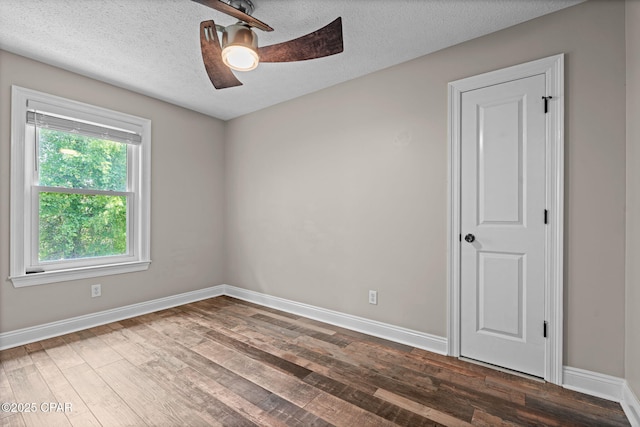 2932 Palmetto Ridge Way, Lynn Haven, FL 32444 - empty room with ceiling fan, dark wood-type flooring, and a textured ceiling