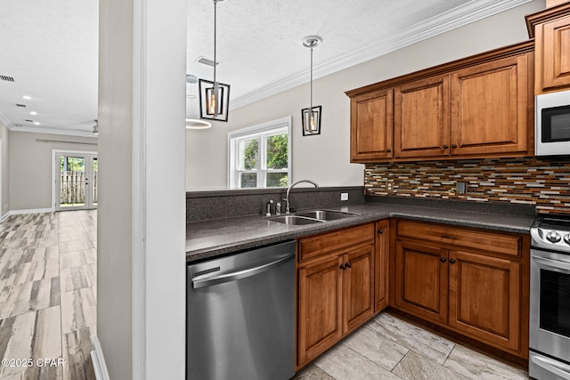 2932 Palmetto Ridge Way, Lynn Haven, FL 32444 - kitchen with stainless steel appliances, dark countertops, brown cabinetry, tasteful backsplash, and ornamental molding