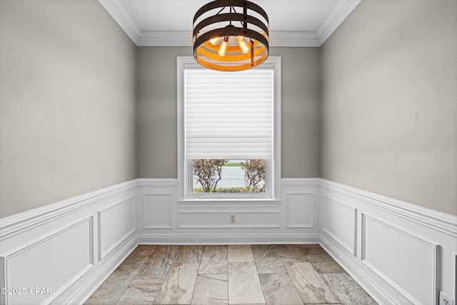 2932 Palmetto Ridge Way, Lynn Haven, FL 32444 - spare room with wainscoting, a textured ceiling, ornamental molding, and a chandelier