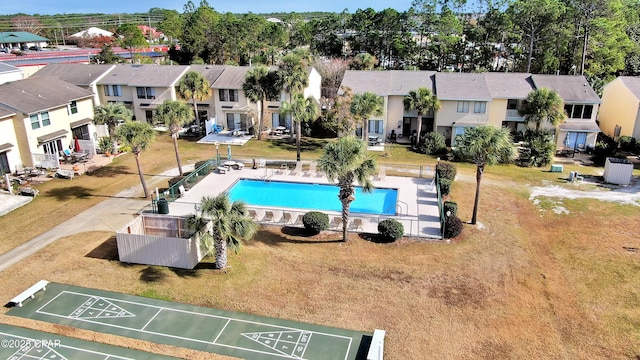 116 Damon Cir Unit C, Panama City Beach, FL 32407 - community pool with shuffleboard, a residential view, and a yard