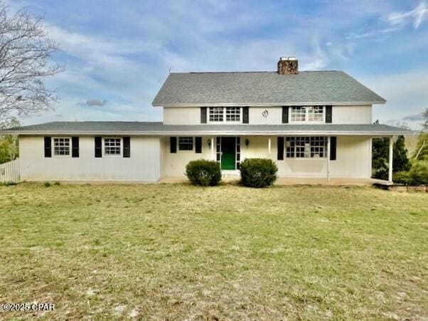 1348 Sleepy Hollow Dr, Marianna, FL 32448 - rear view of property with a lawn, a chimney, and covered porch