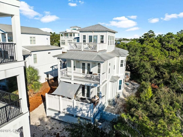 45 Eagles Lndg, Inlet Beach, FL 32461 - rear view of property featuring a balcony and a metal roof